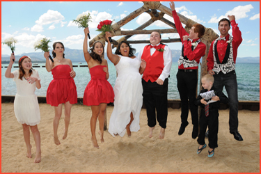 Happy bridal party jumping in the air