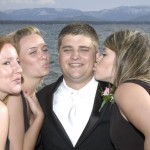 The groom is surrounded by the bridesmaids