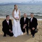 Groomsmen kneel beside the bride