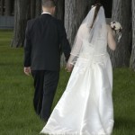 Newlyweds holding hands after their wedding