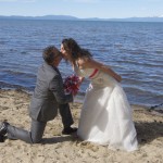 Groom gets on his knee to kiss his bride