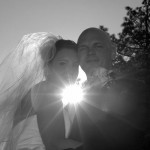 The sun causes silhouetting of the posing couple