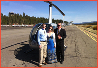 Minister poses on tarmac with couple